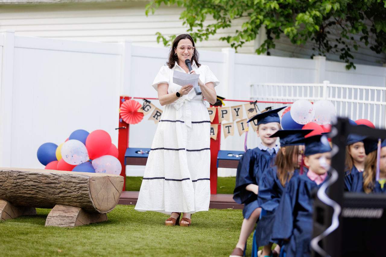 Franchise owner on graduation day with children graduating
