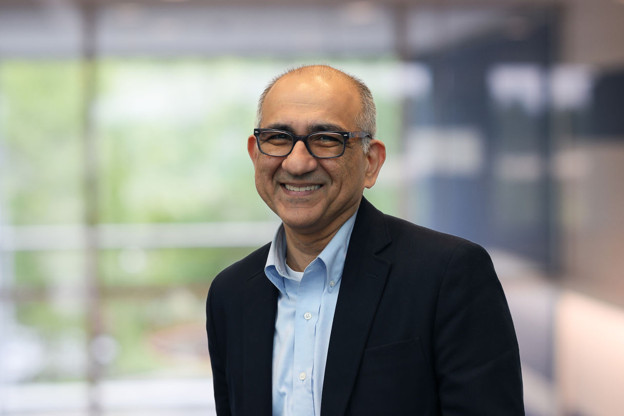 Dr. Ali Tafreshi,  SVP, Chief Information Officer headshot in front of window
